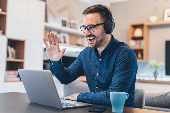 man waving while on an online call