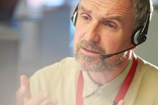 man wearing headset on phone helpline