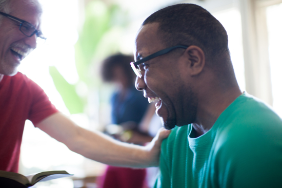 Two male adults laughing