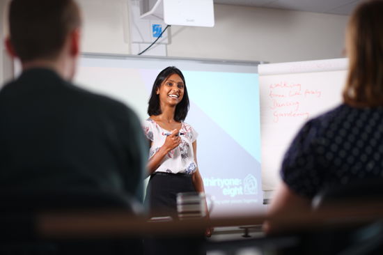a woman delivering training
